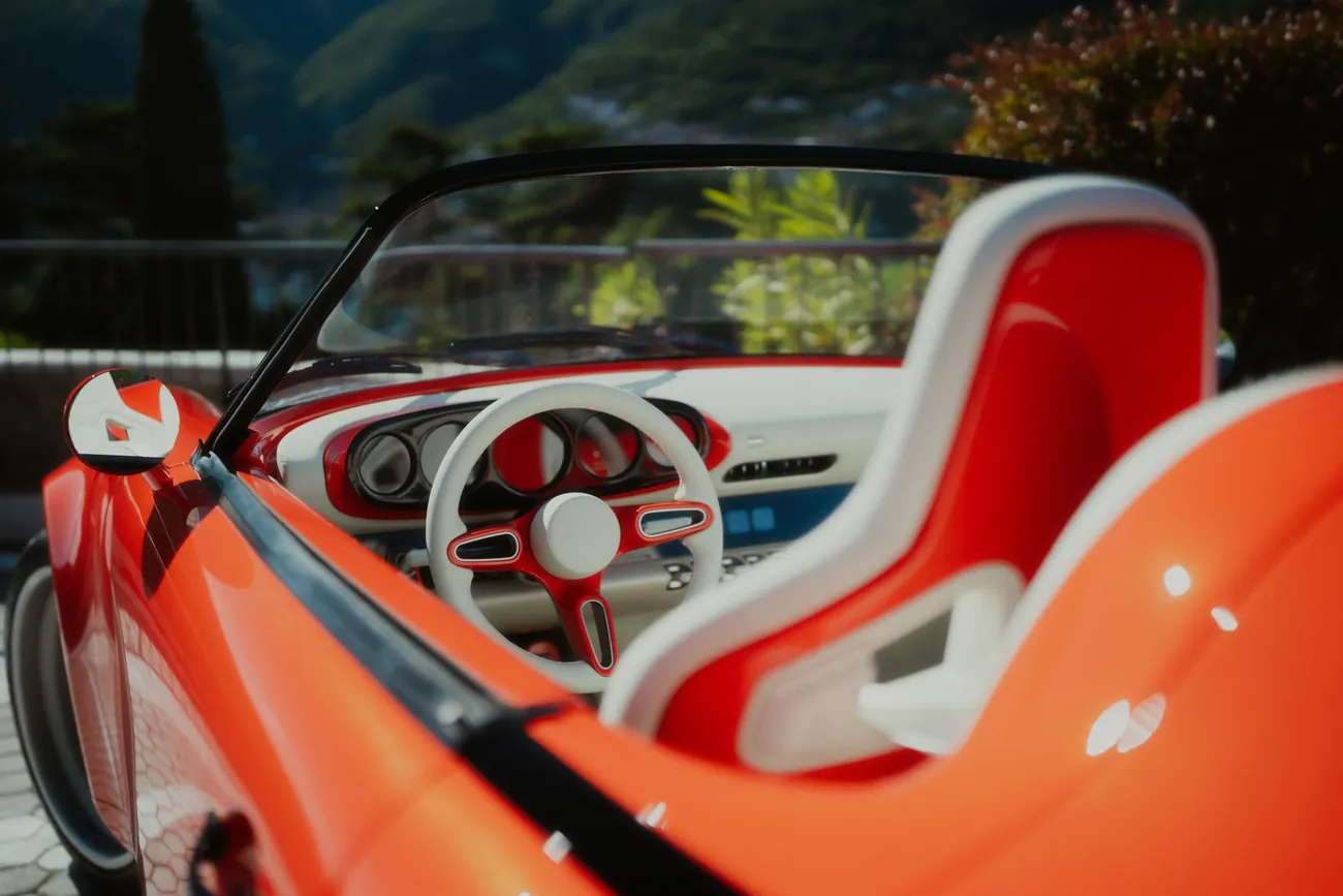 Cream and orange Recaro seats and dashboard seen from above