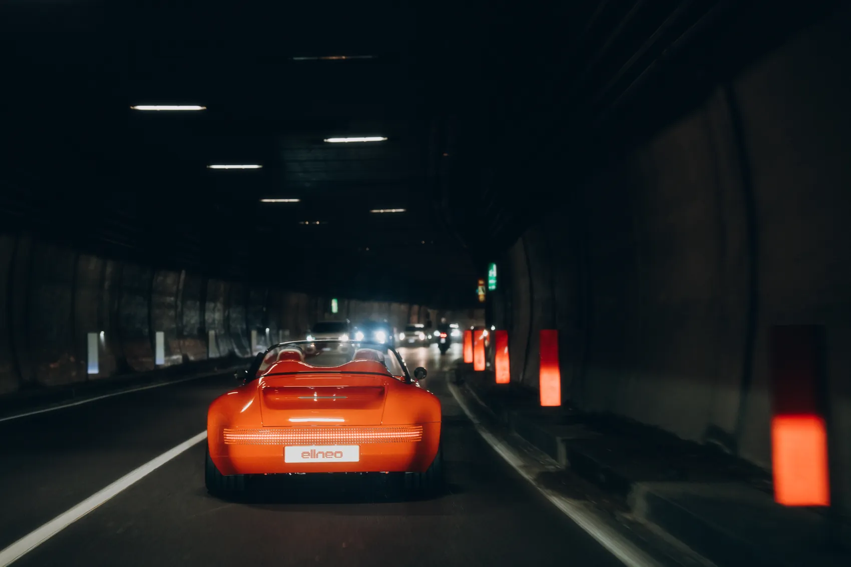 The Funkster from behind in a dark tunnel, its rear light glowing